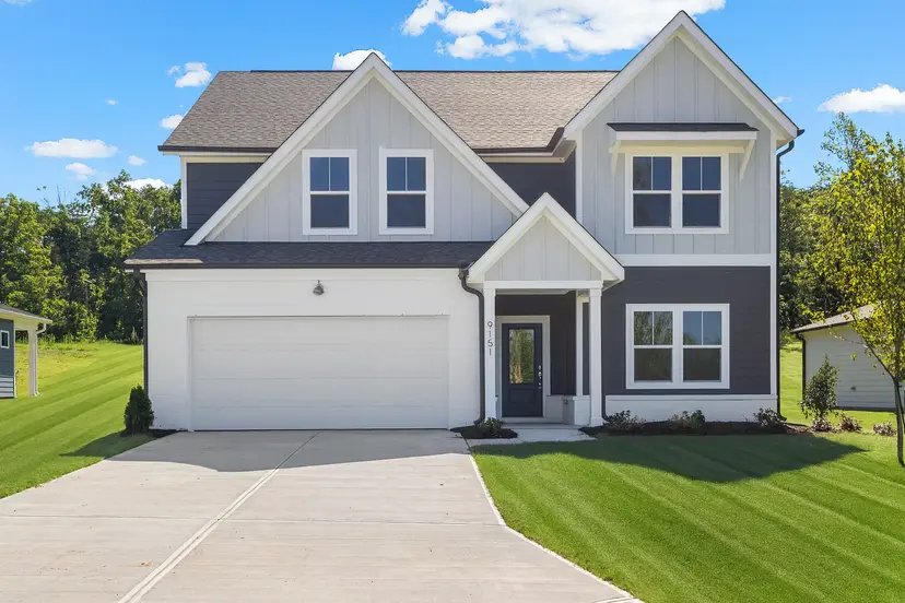 Garman home with gray and white siding and a two-car garage